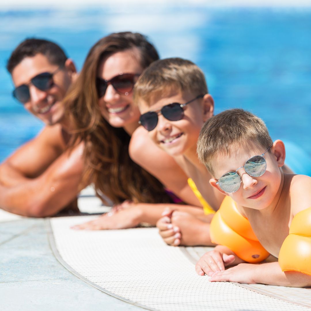 smiling family in pool