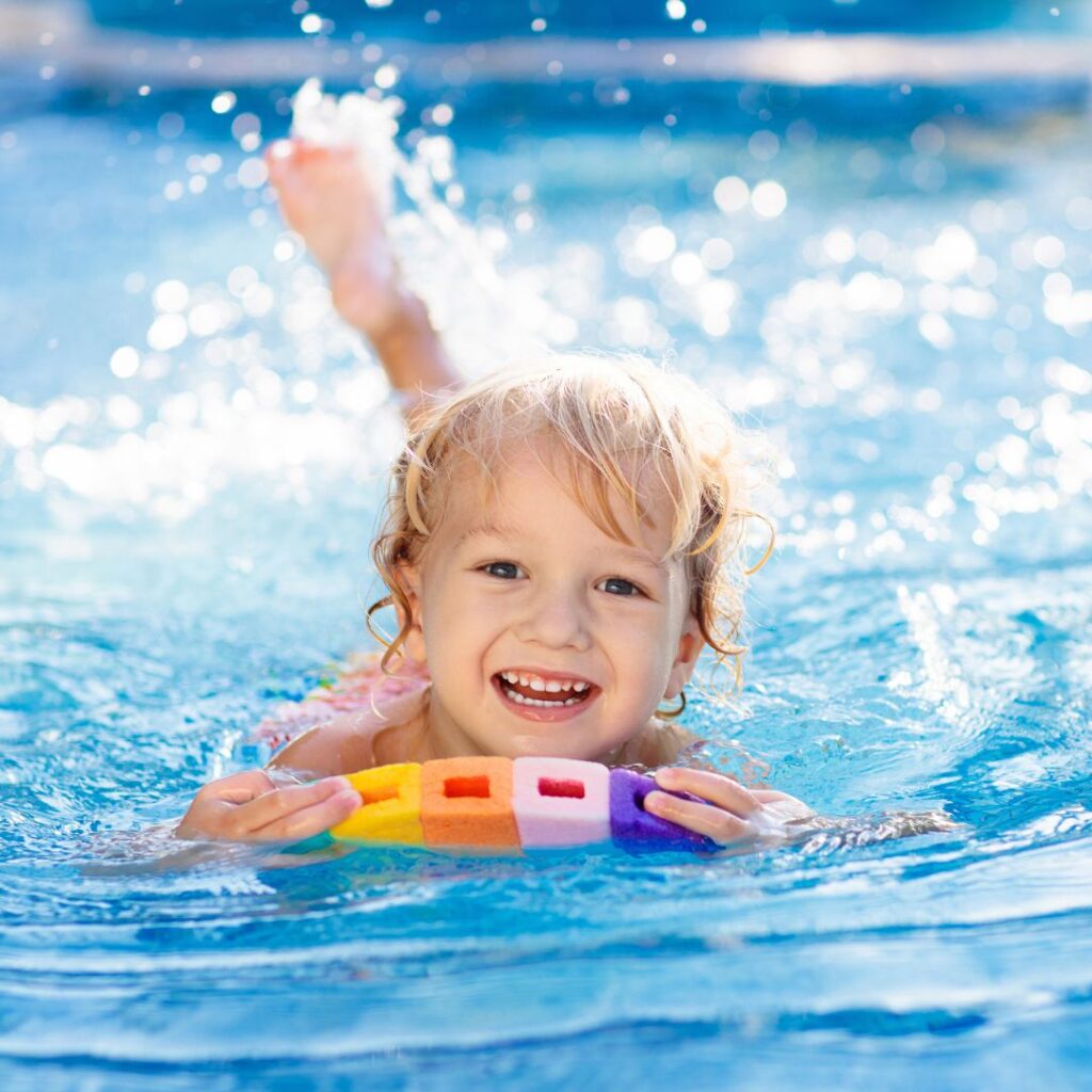 Kid using a floaty to paddle