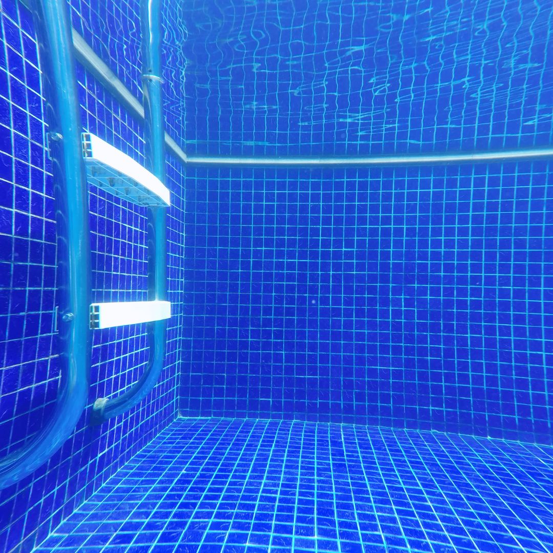 Pool tile and pool ladder underwater