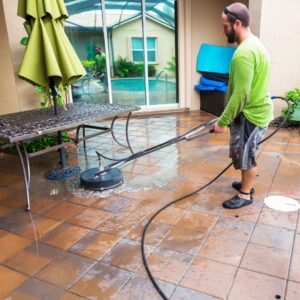 Man cleaning pool tiles