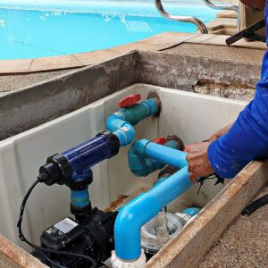 Person repairing a pool pump