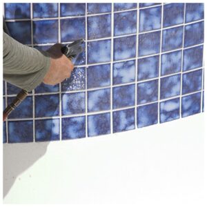 spraying pool tiles to clean