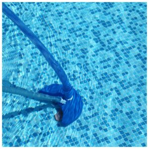 cleaning tiles at the bottom of a pool