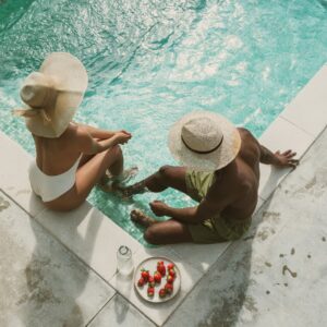 People lounging in a pool.