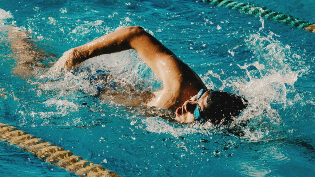 Person swimming laps in a pool.