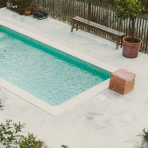clean pool in backyard
