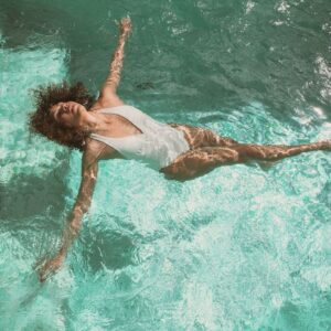 woman enjoying her pool