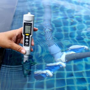 a person testing a pool