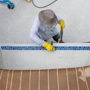 a man repairing a pool