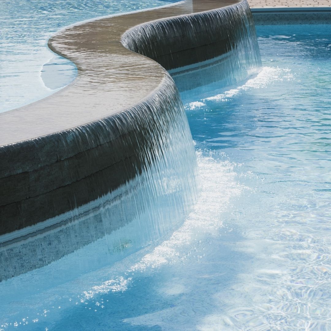 clean pool with running fountain